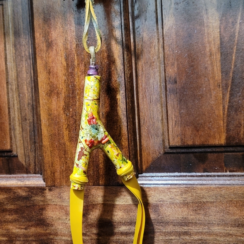 Gem encrusted slingshot necklace